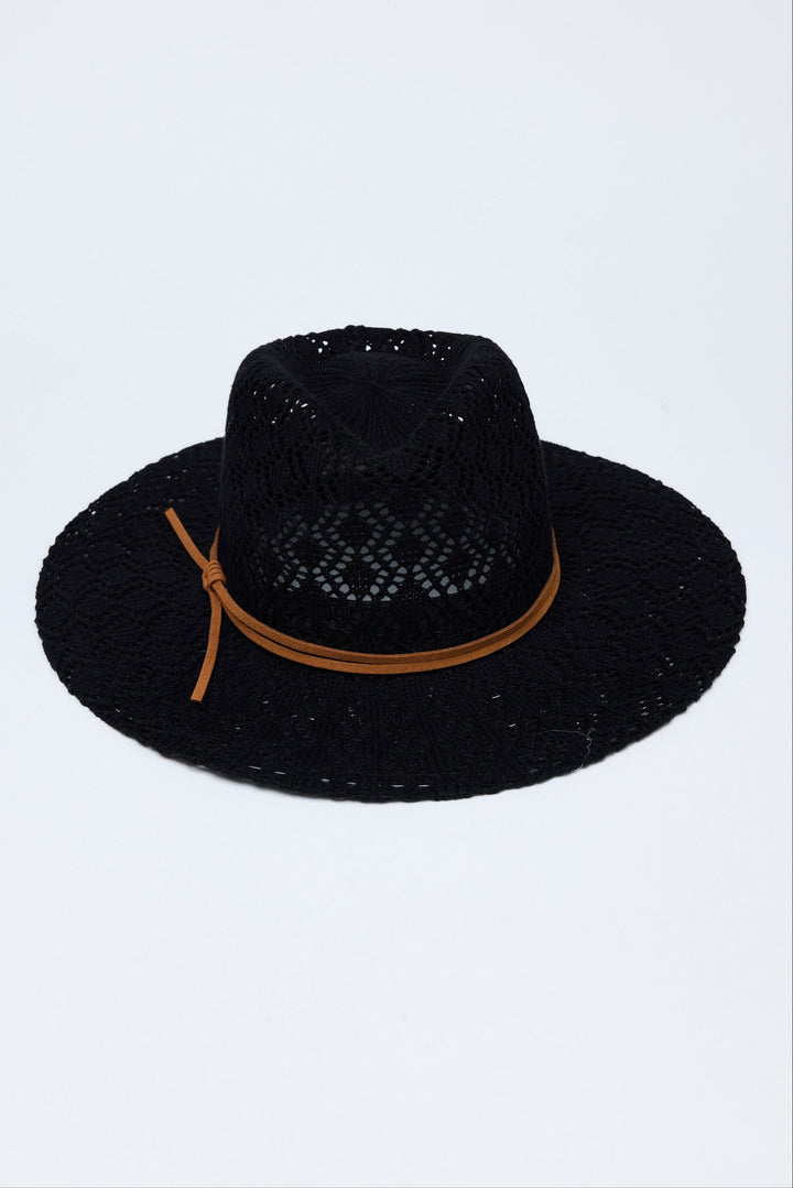 Black hat with a brown band on a light gray background