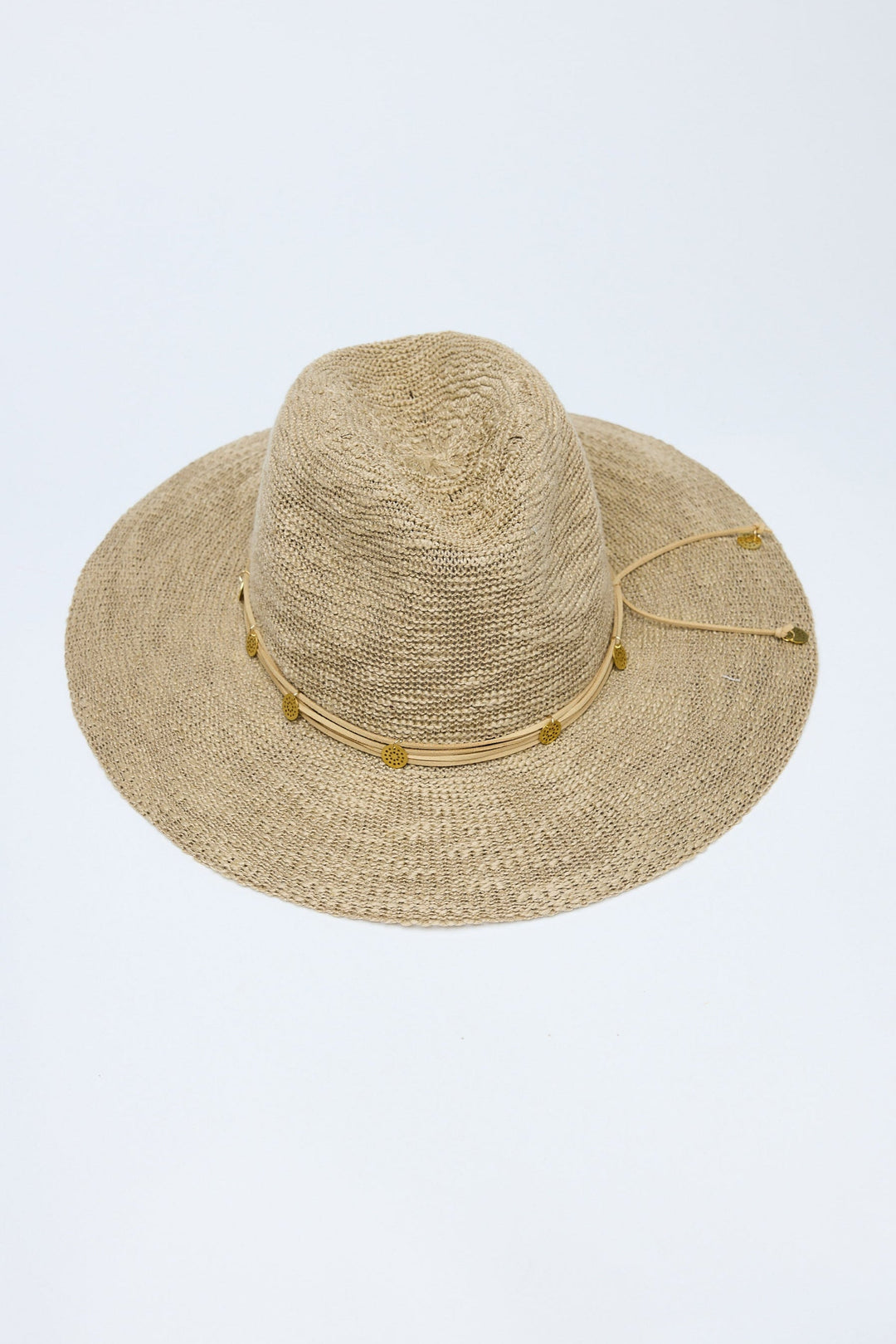 Beige straw hat with a wide brim on a light gray background