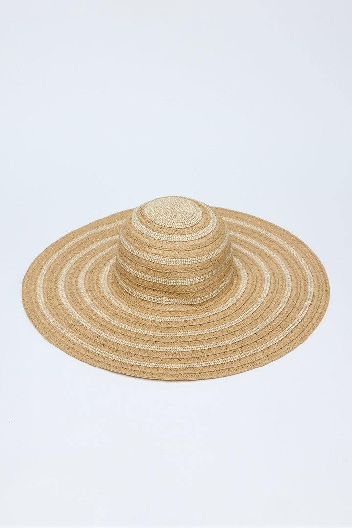 Beige straw hat on a light blue background