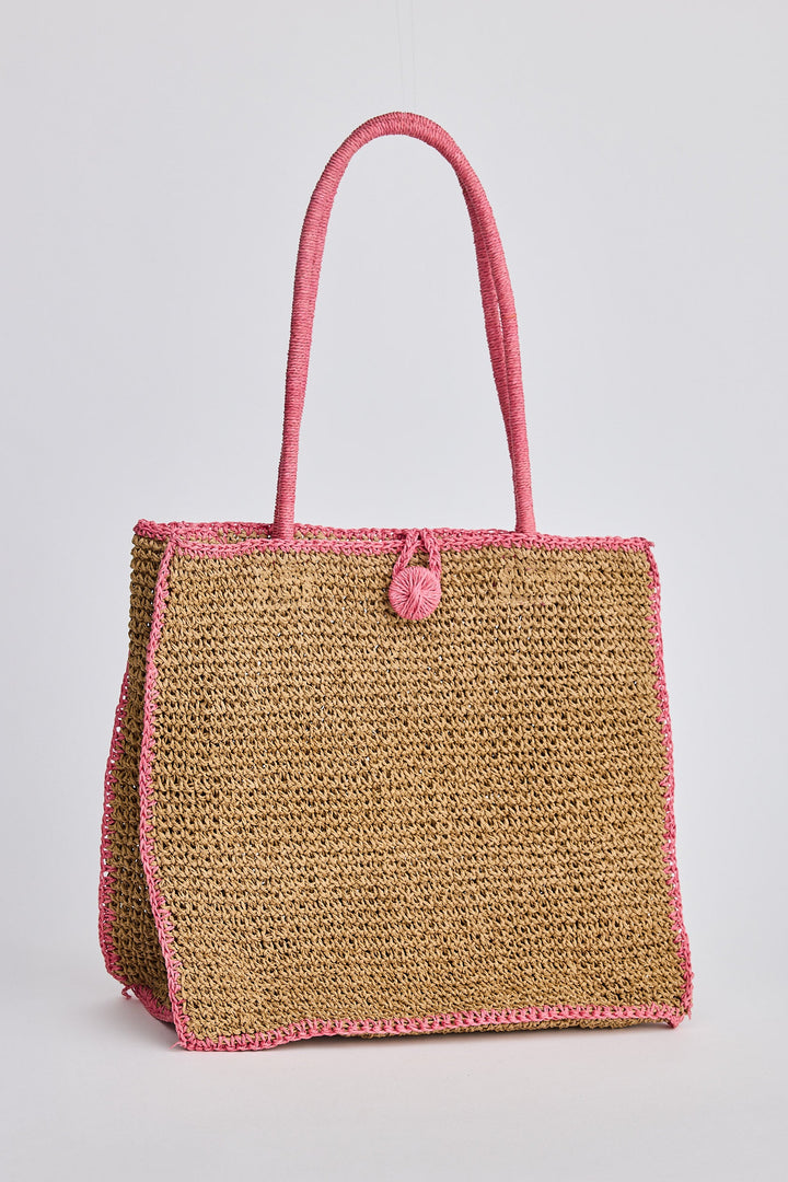 Brown woven bag with pink trim on a light gray background