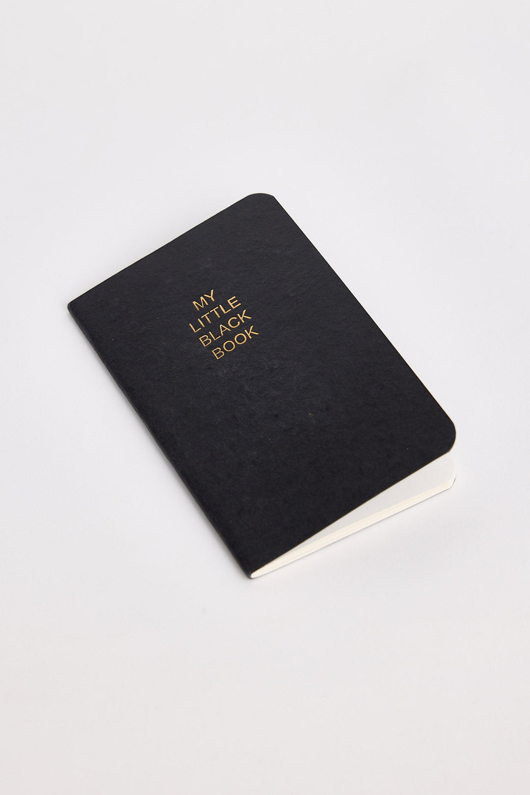 Black notebook with 'My Little Black Book' text on a white background