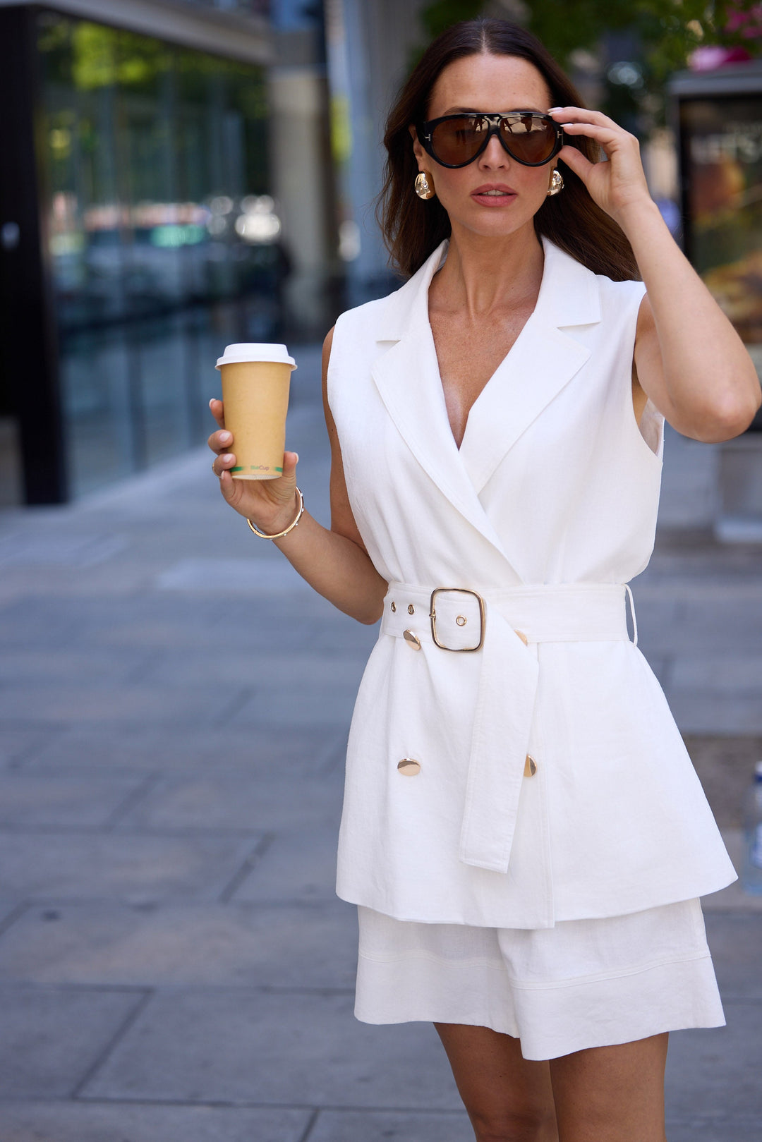 Model wearing brown paparazzi sunglasses
