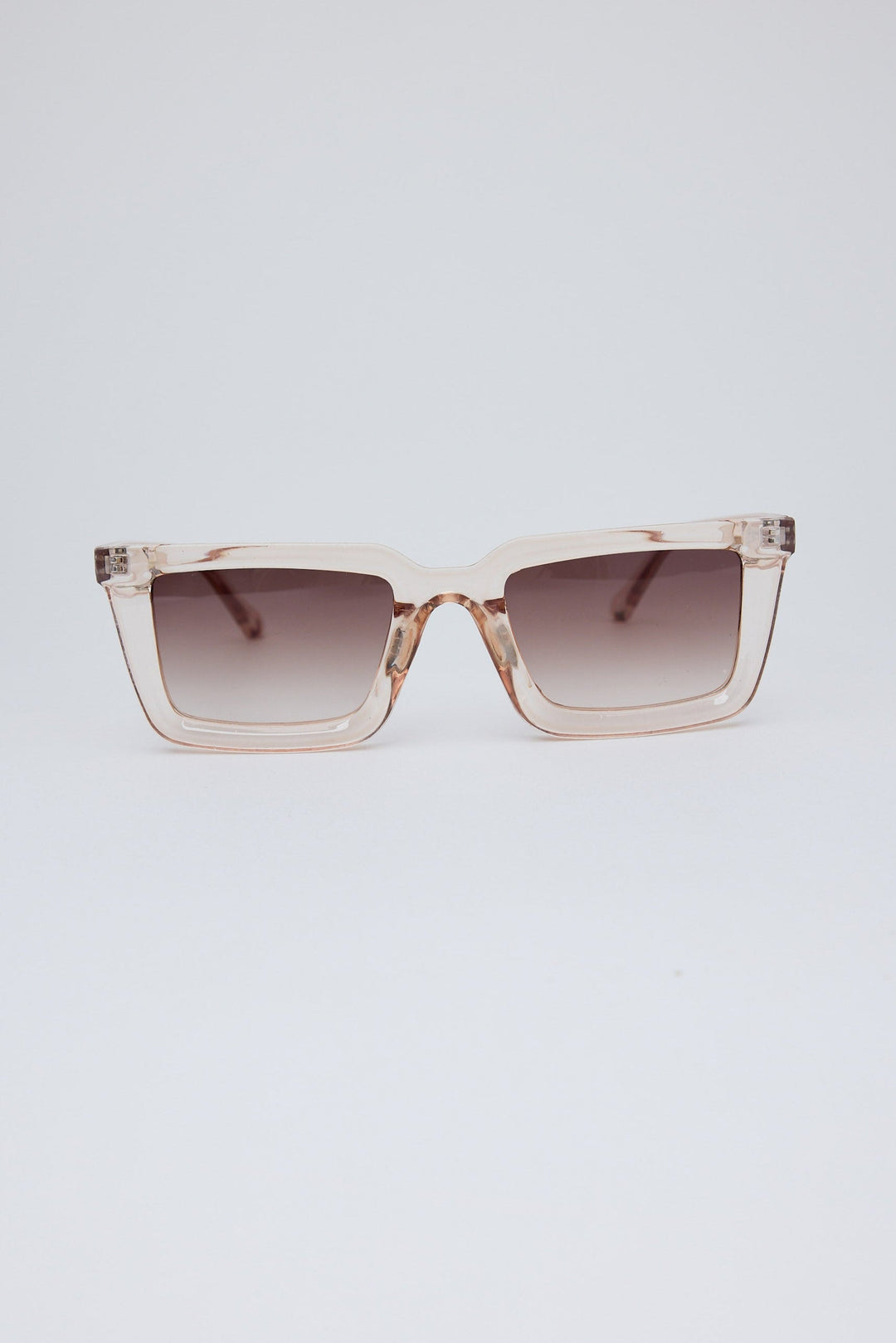 Sunglasses with a gradient lens on a light gray background