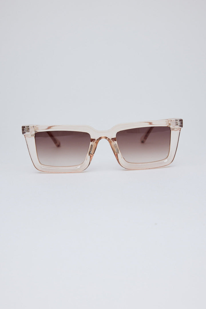 Sunglasses with a gradient lens on a light gray background
