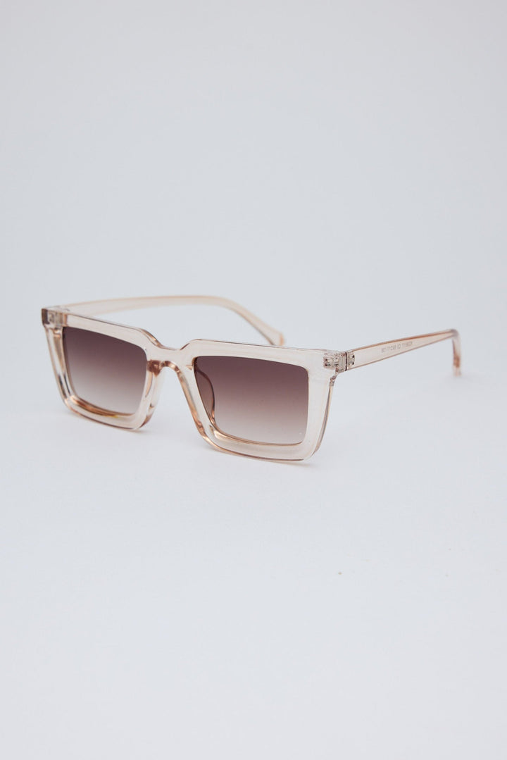Sunglasses with a gradient lens on a light gray background