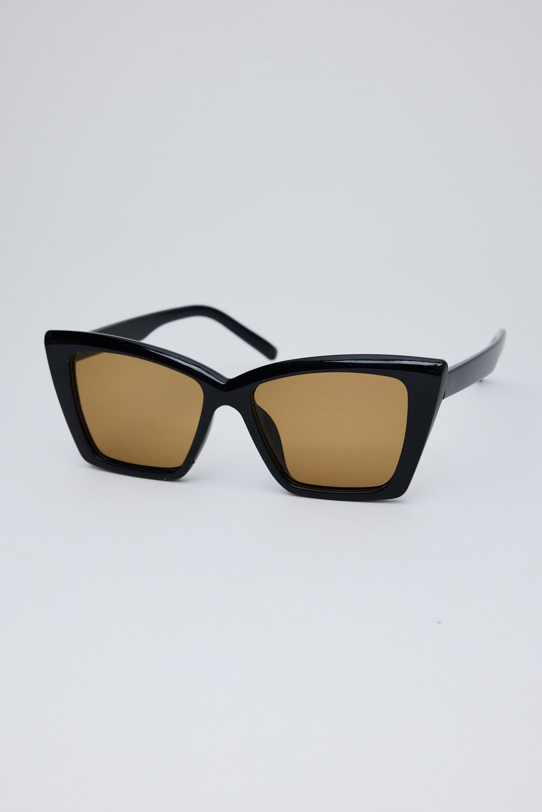 Angled view of Black W Orange Venice Sunglasses on white background