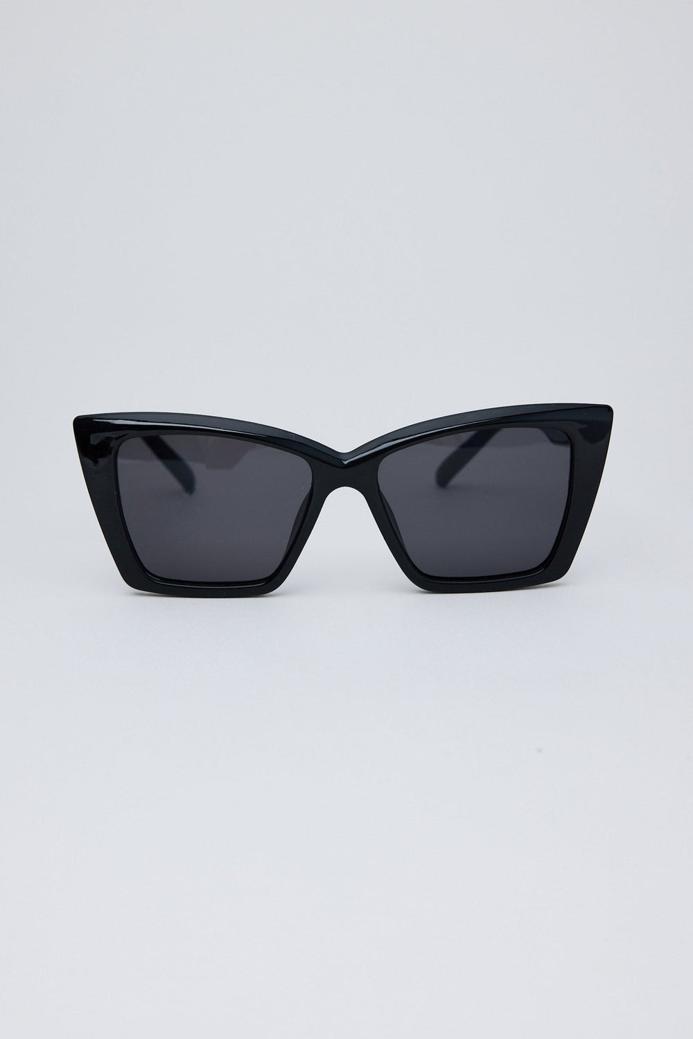 Black cat-eye sunglasses on a light gray background