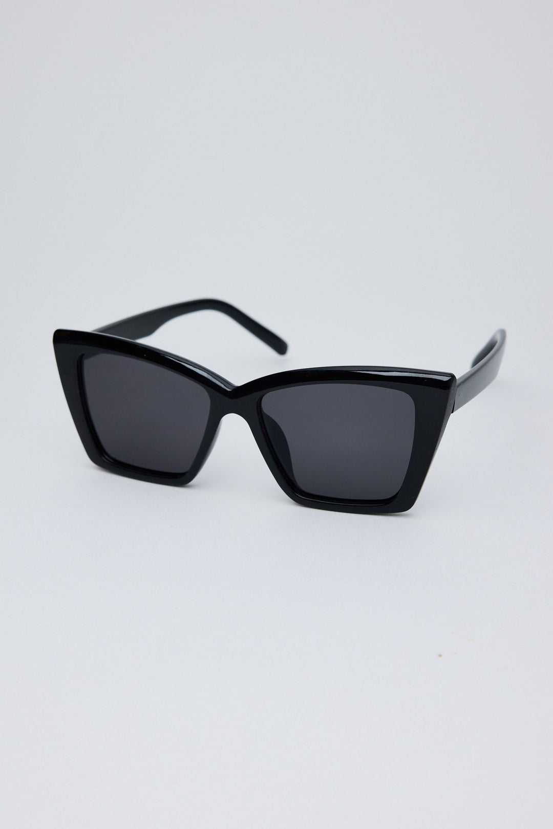 Angled view of Black Venice Sunglasses on white background