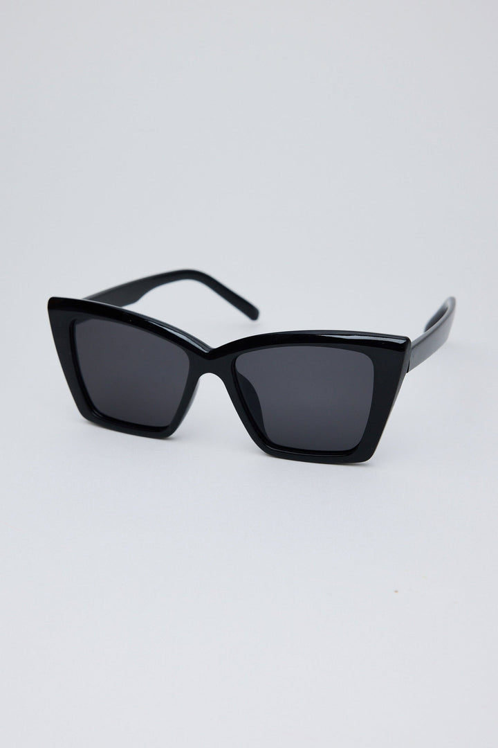 Angled view of Black Venice Sunglasses on white background