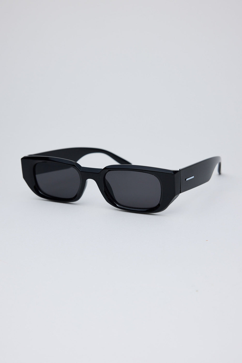Angled view of Black Beverly Sunglasses on white background
