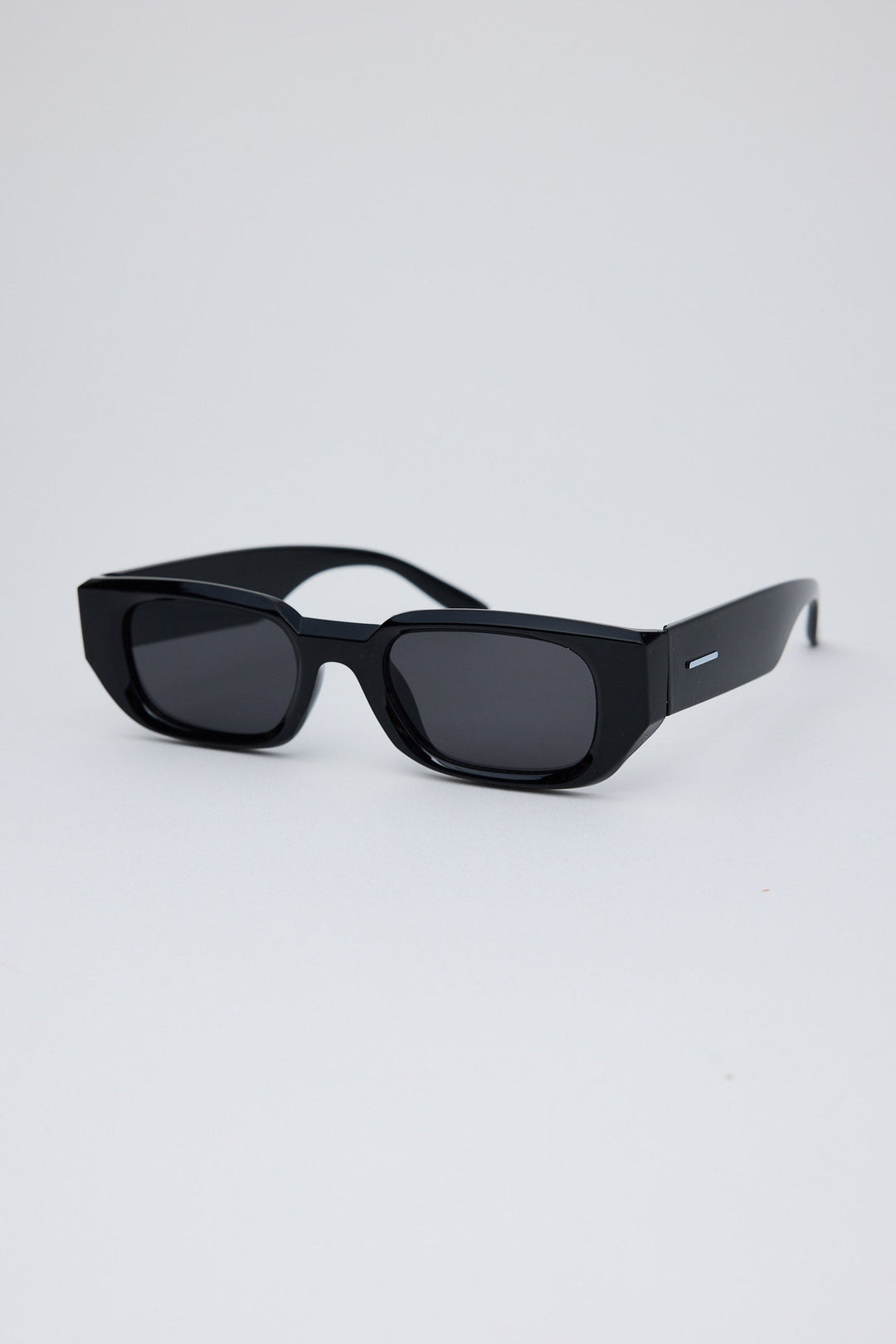 Angled view of Black Beverly Sunglasses on white background