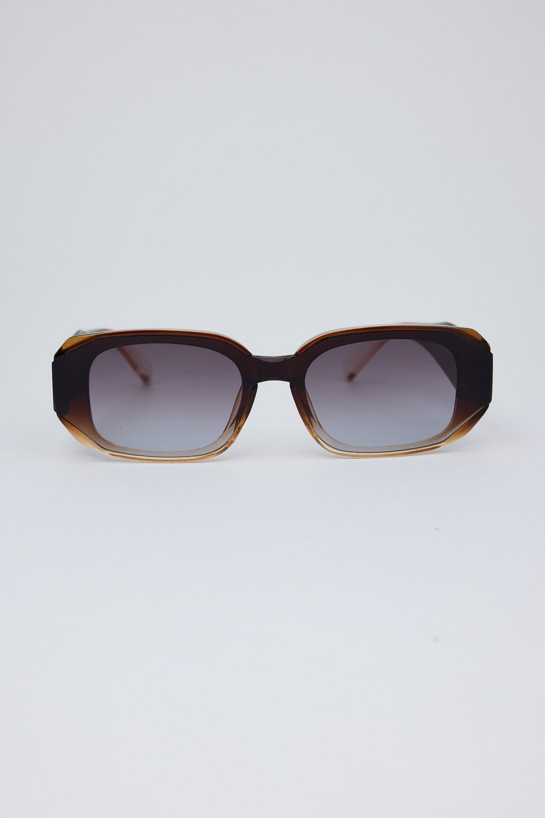Sunglasses with a tortoiseshell frame on a white background