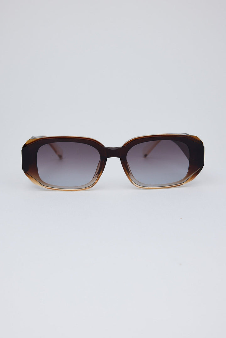 Sunglasses with a tortoiseshell frame on a white background