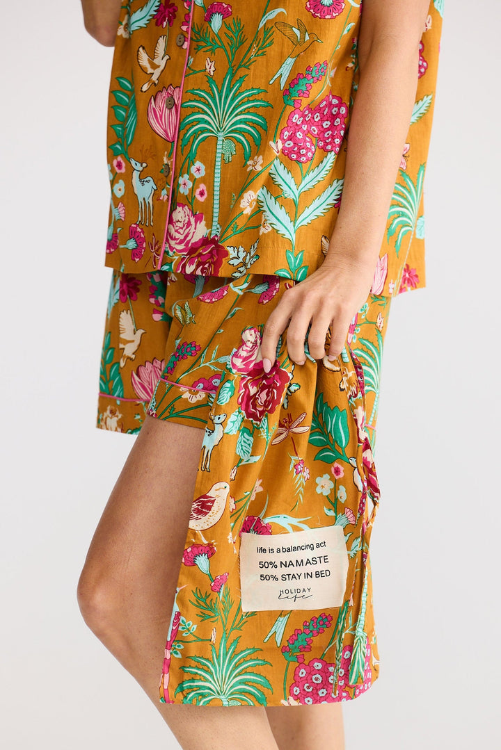 Floral set with matching bag with a label on a white background