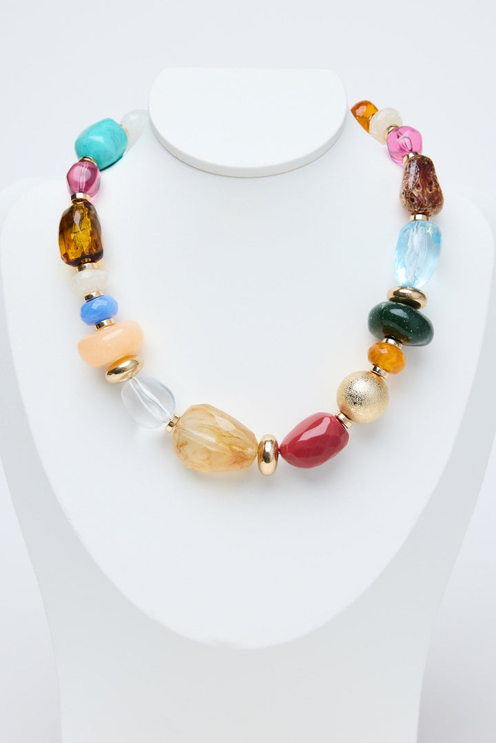 Multicolored beaded necklace on a white background