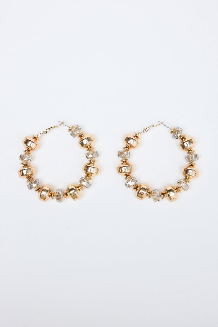 Gold hoop earrings with small beads on a white background