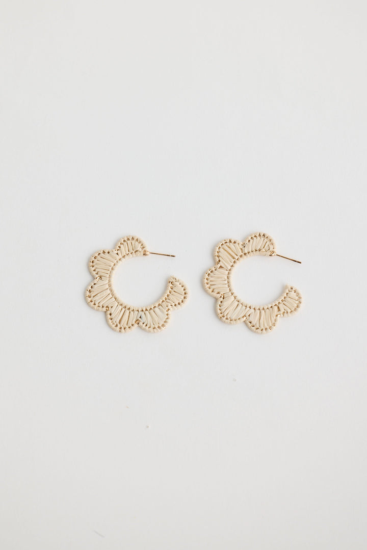 Close-up of natural hannah earrings earrings on white background.