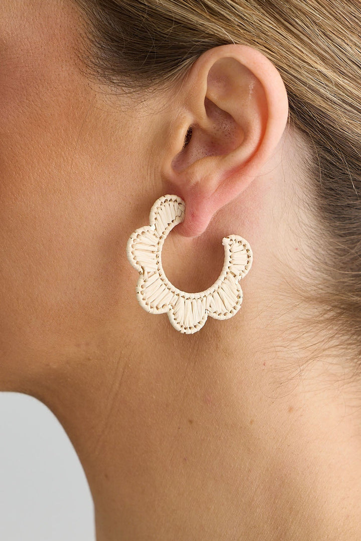 Close-up of natural hannah earrings earrings on white background.