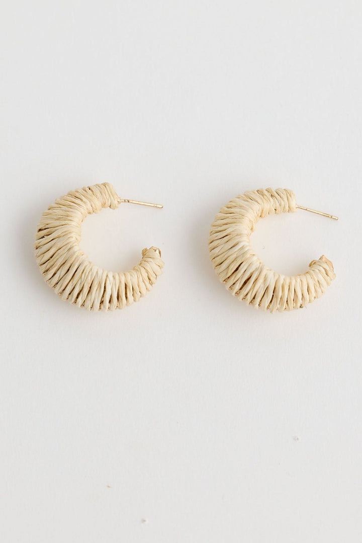 Close-up of natural nala earrings earrings on white background.
