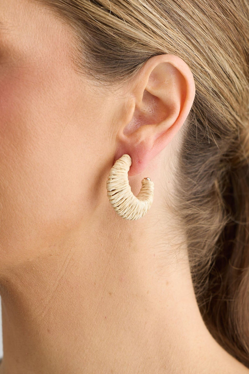 Close-up of natural nala earrings earrings on white background.