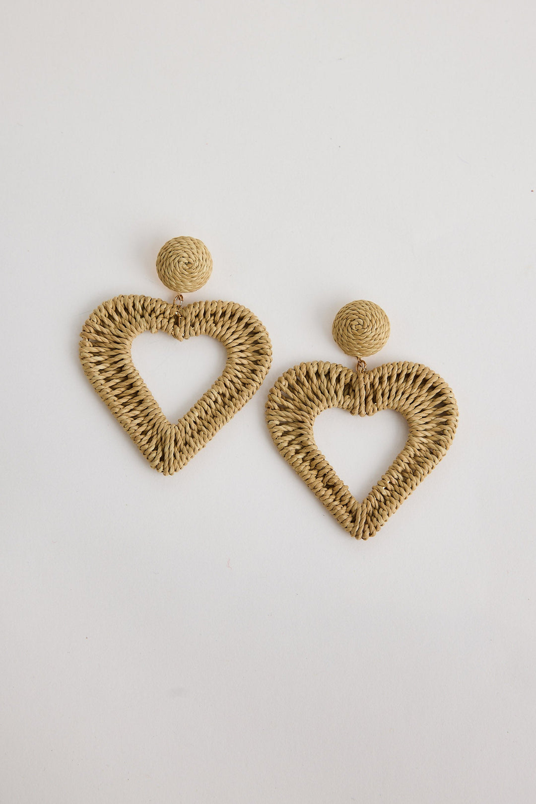 Heart-shaped natural earrings on a light background
