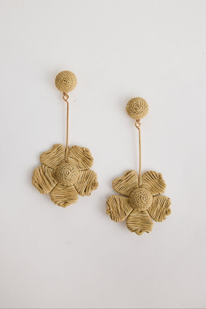 Pair of natural floral earrings on a white background