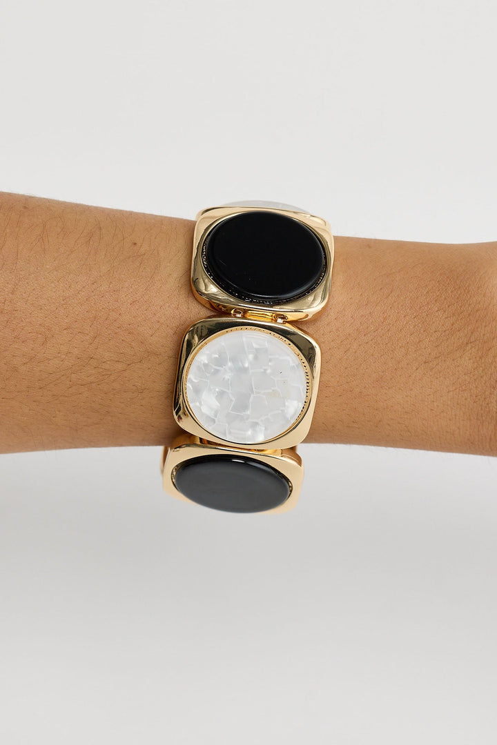 Close-up of black w white rover stretch bracelet bracelet on white background.