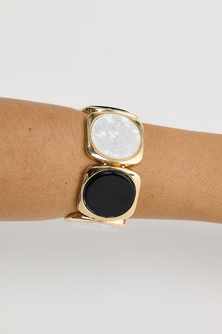 Close-up of black w white rover stretch bracelet bracelet on white background.