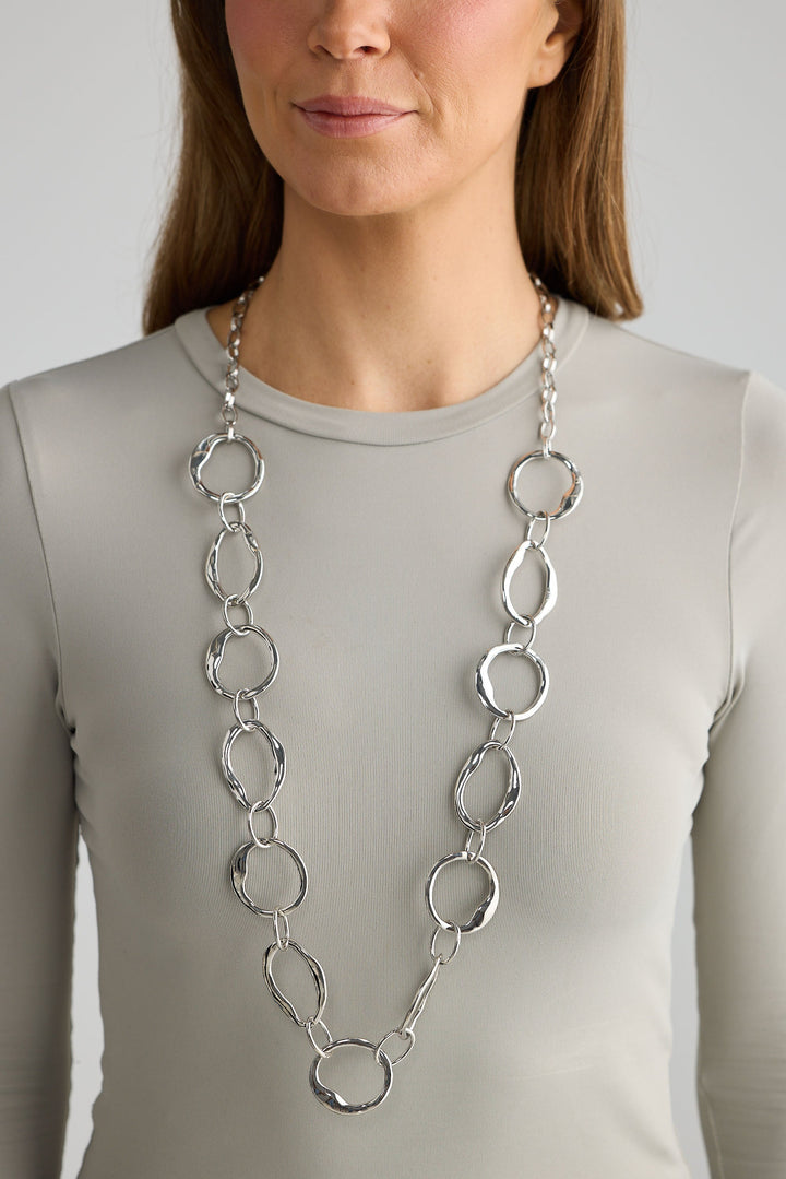 Close-up of silver hemsworth necklace necklace on white background.