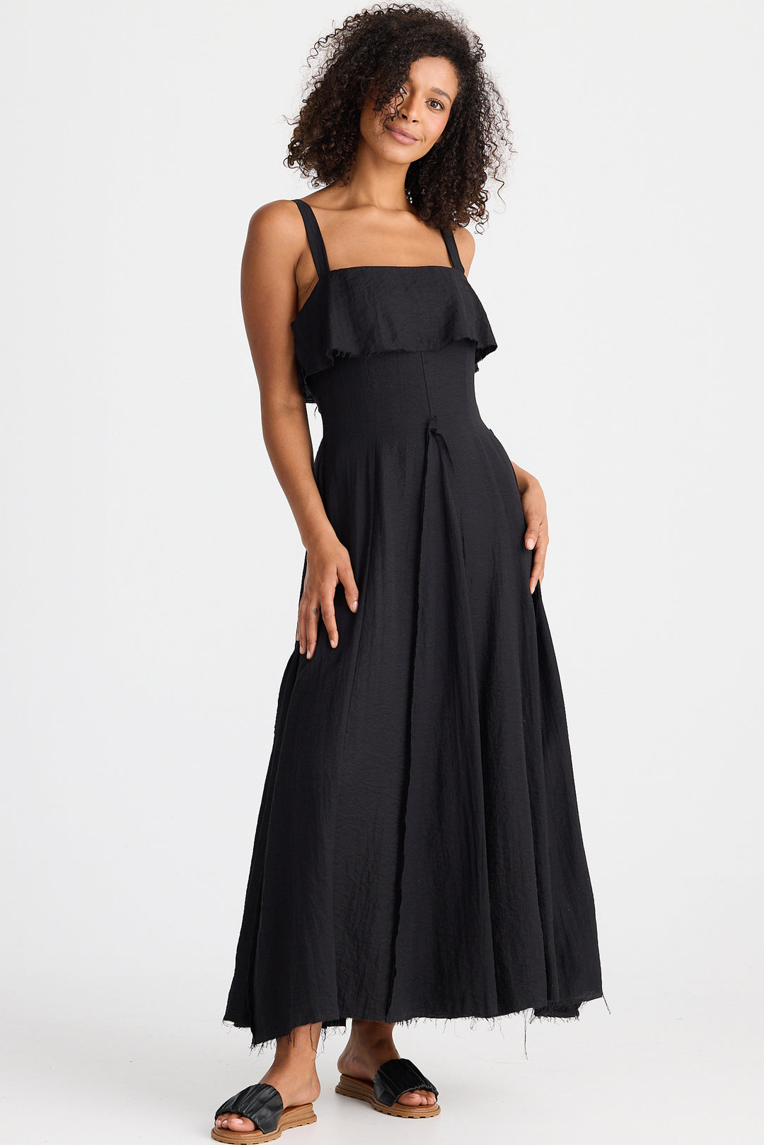 Woman wearing a black dress on a white background