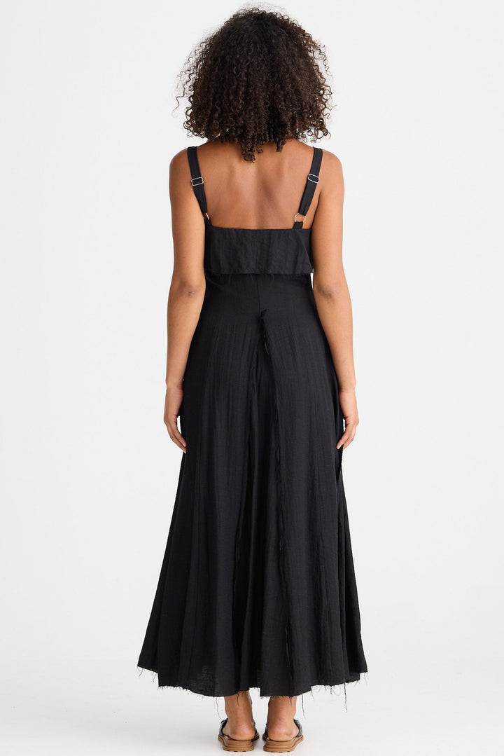 Woman wearing a black dress with a white background