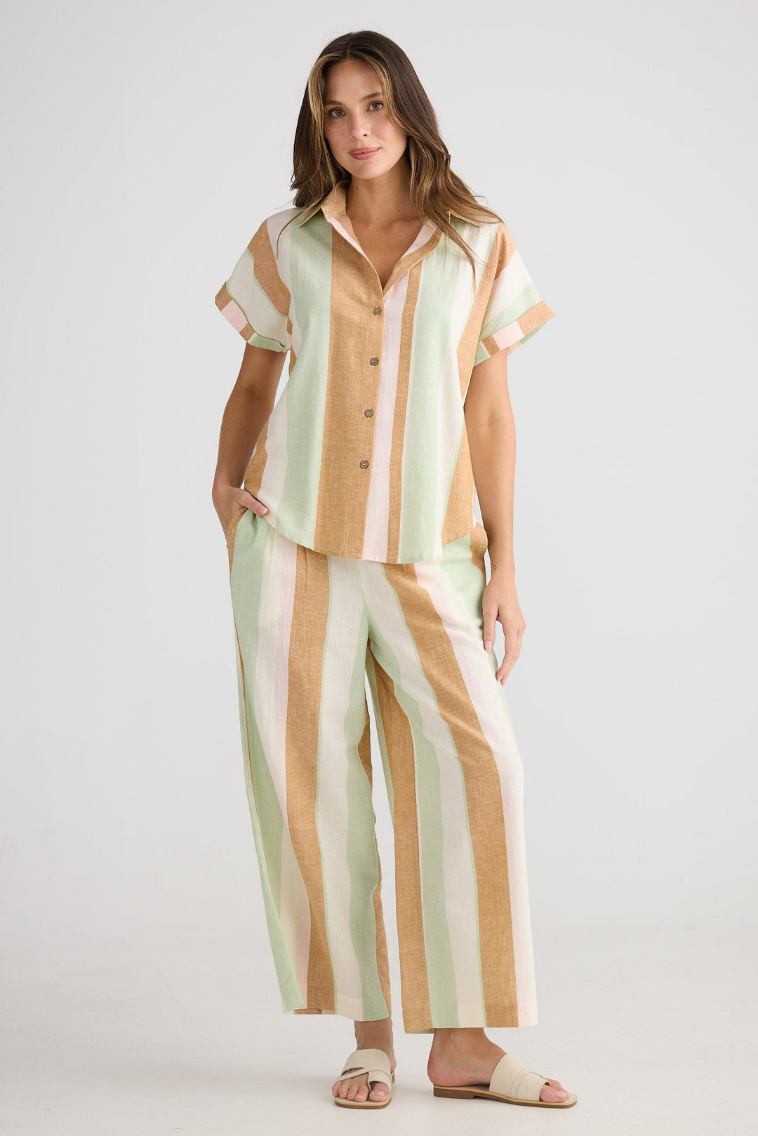 Woman wearing a striped outfit on a white background