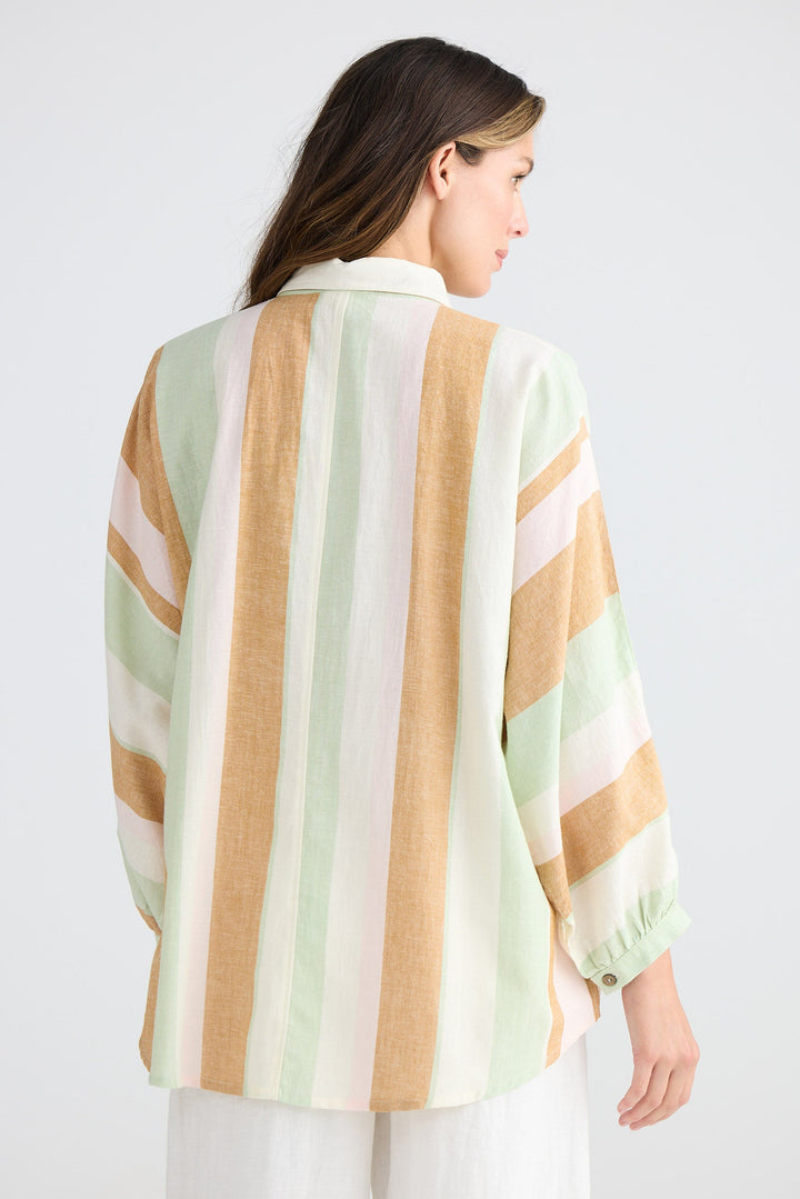 Woman wearing a striped shirt with a white background