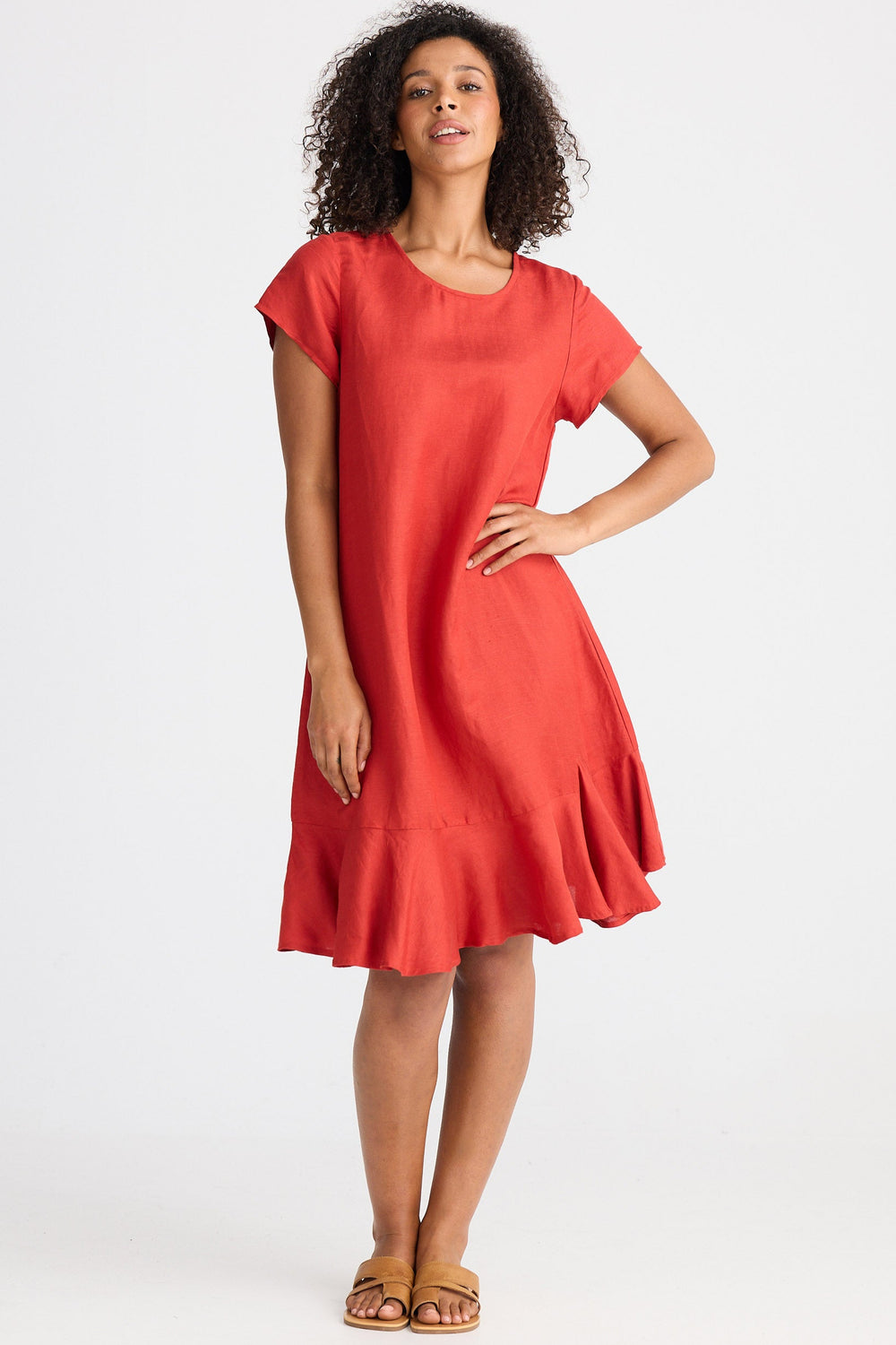 Woman wearing a red dress on a white background