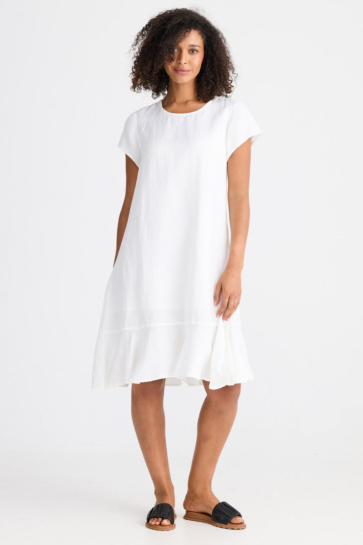 Woman wearing a white dress on a white background