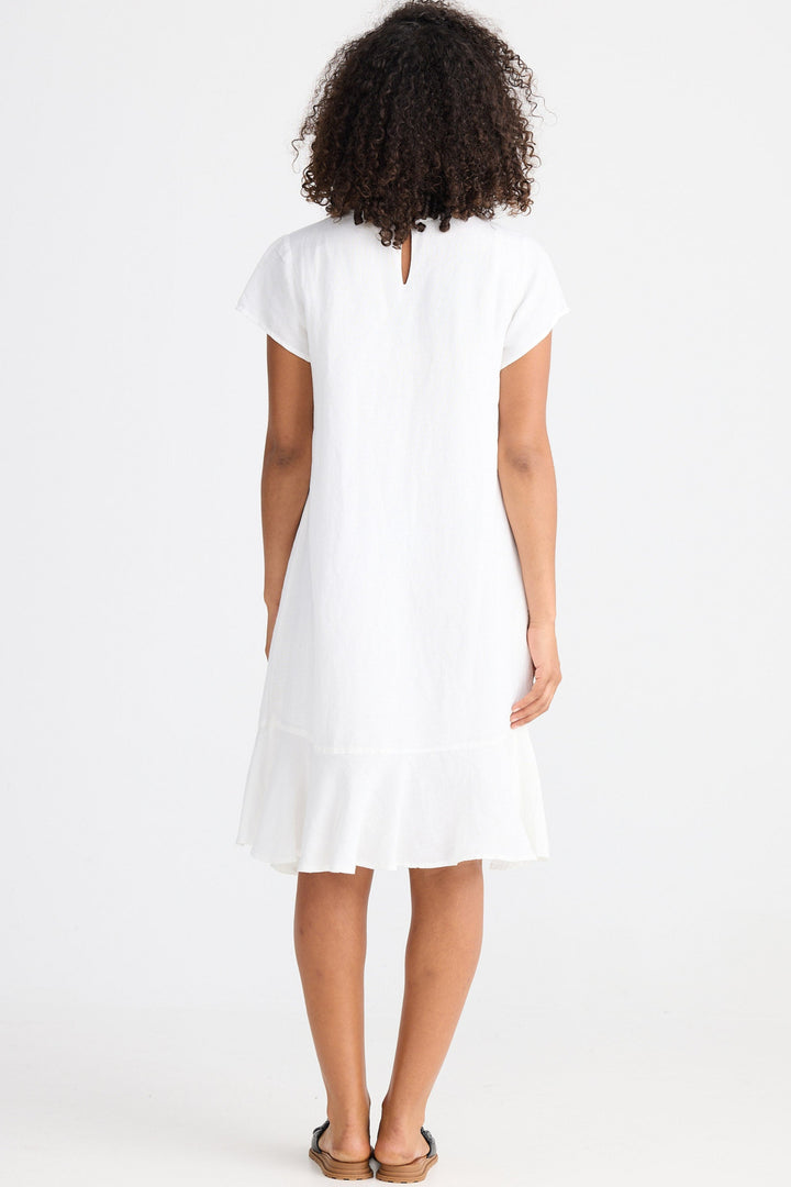 Woman wearing a white dress on a white background