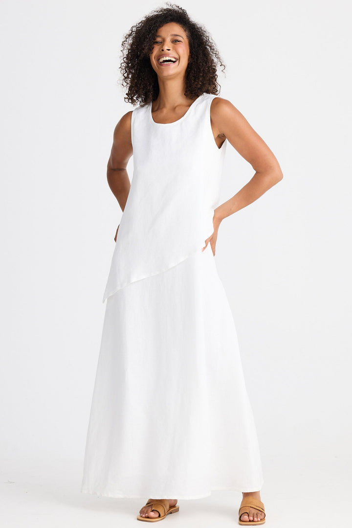 Woman wearing a white dress on a white background
