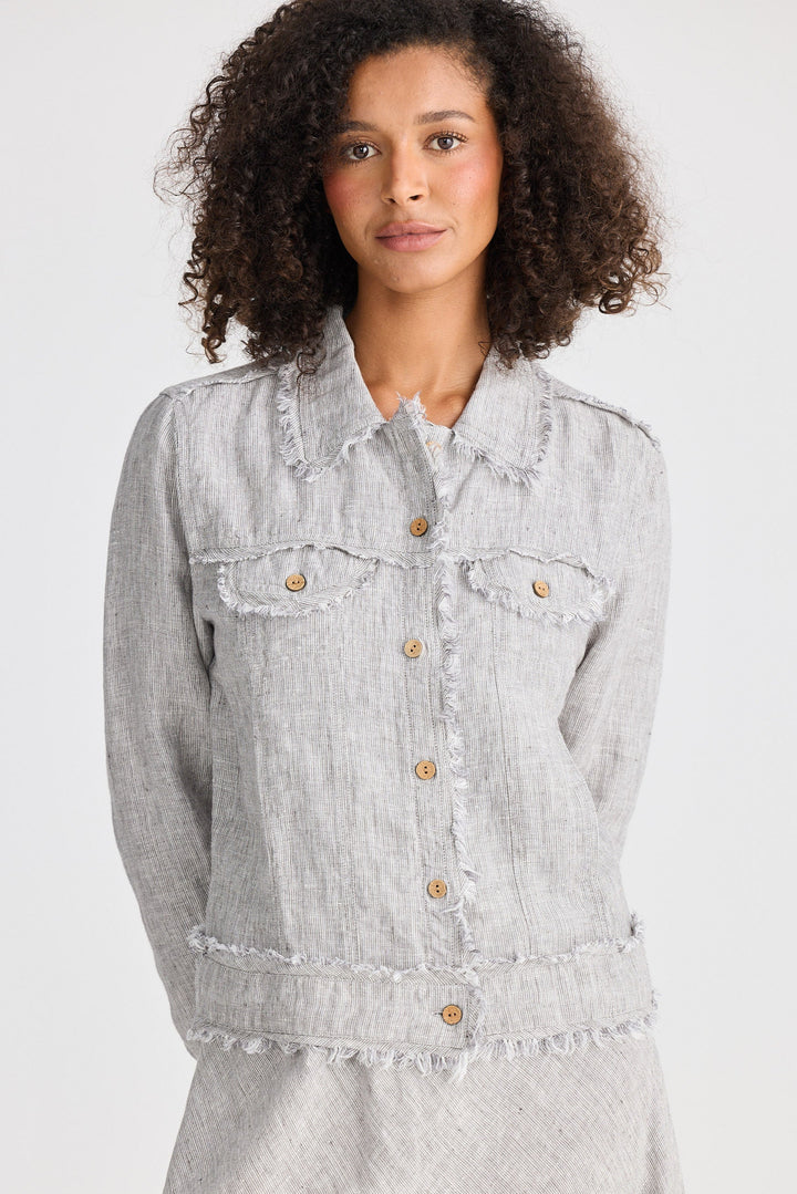 Woman wearing a light gray jacket on a white background