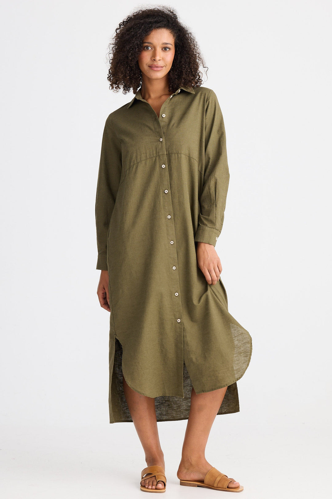 Woman wearing a green dress on a white background