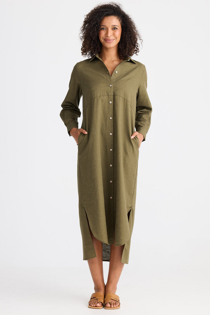 Woman wearing a green dress with a white background