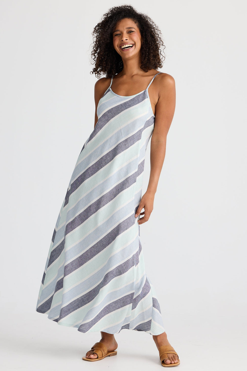 Woman wearing a striped dress on a white background