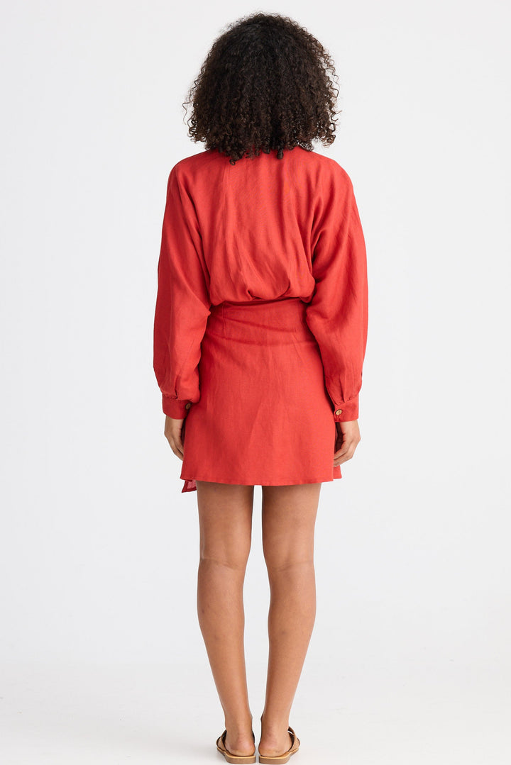 Person wearing a red outfit on a white background