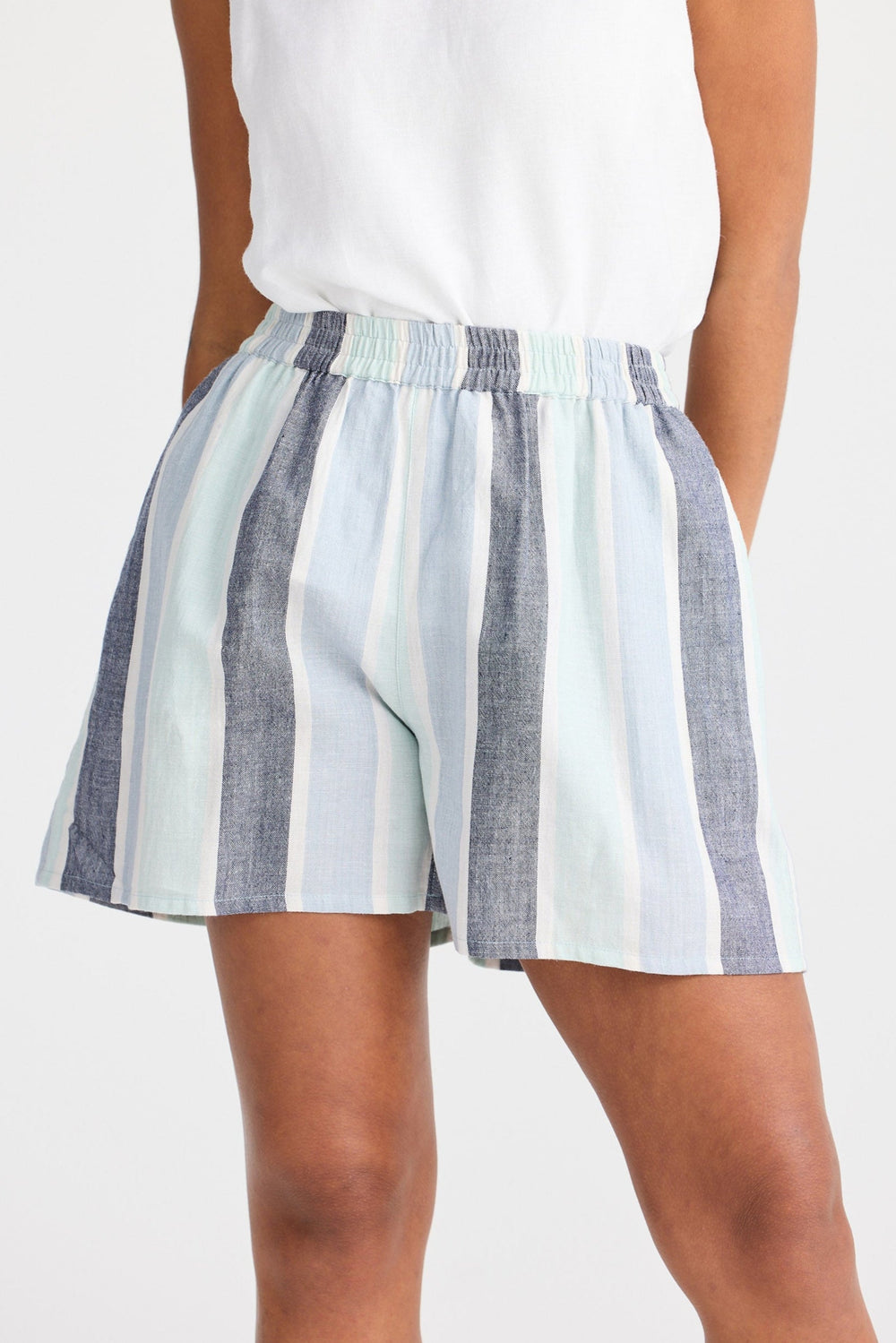 Striped shorts worn by a person on a white background