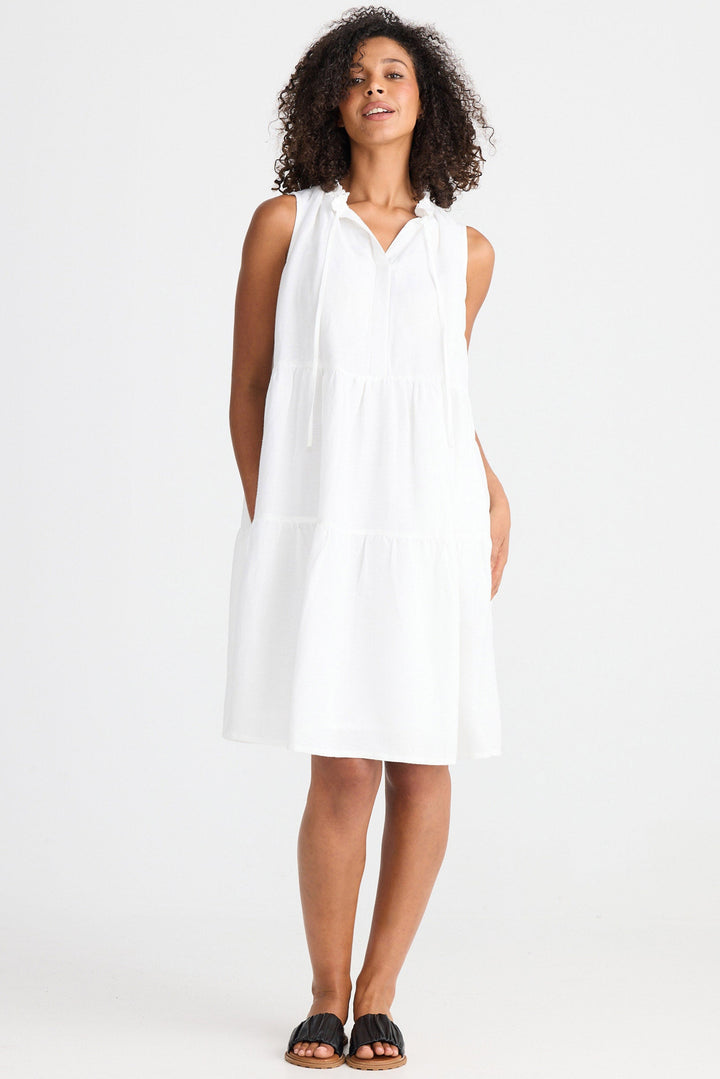 Woman wearing a white dress on a white background