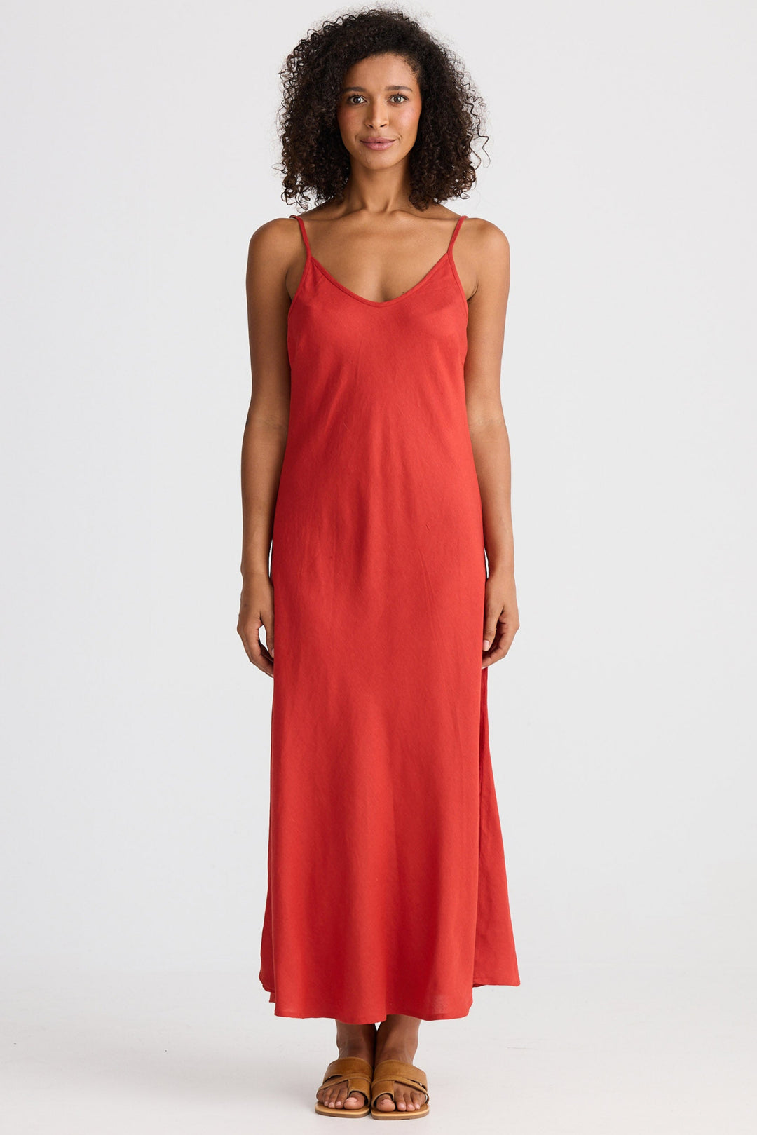 Woman wearing a red dress on a white background