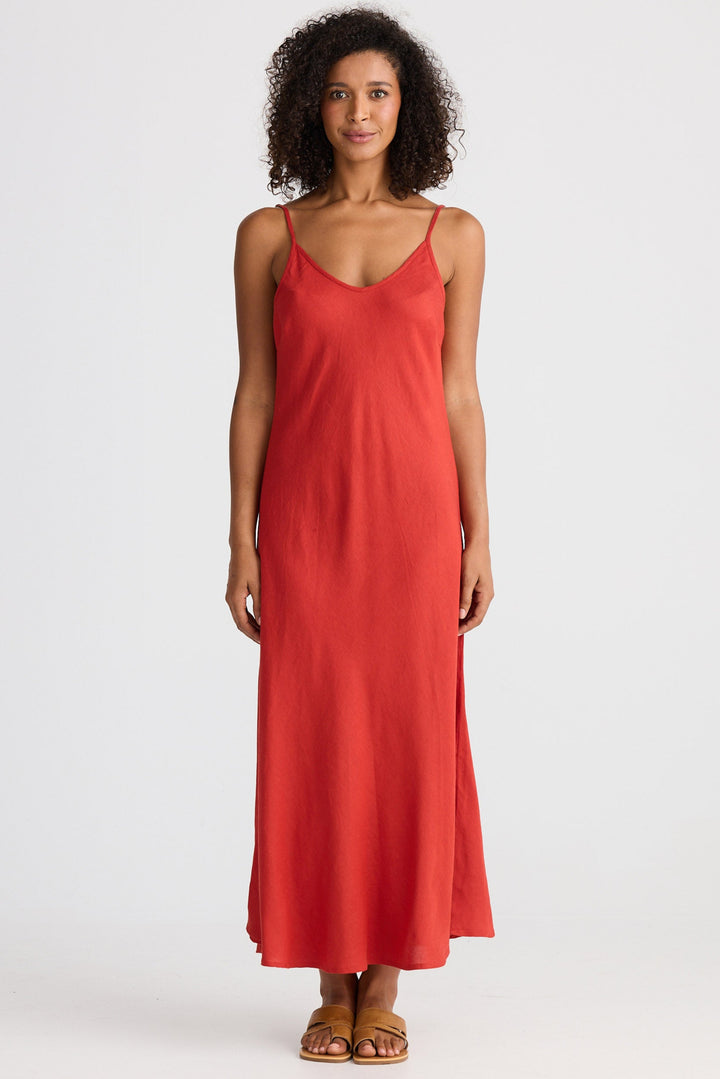 Woman wearing a red dress on a white background