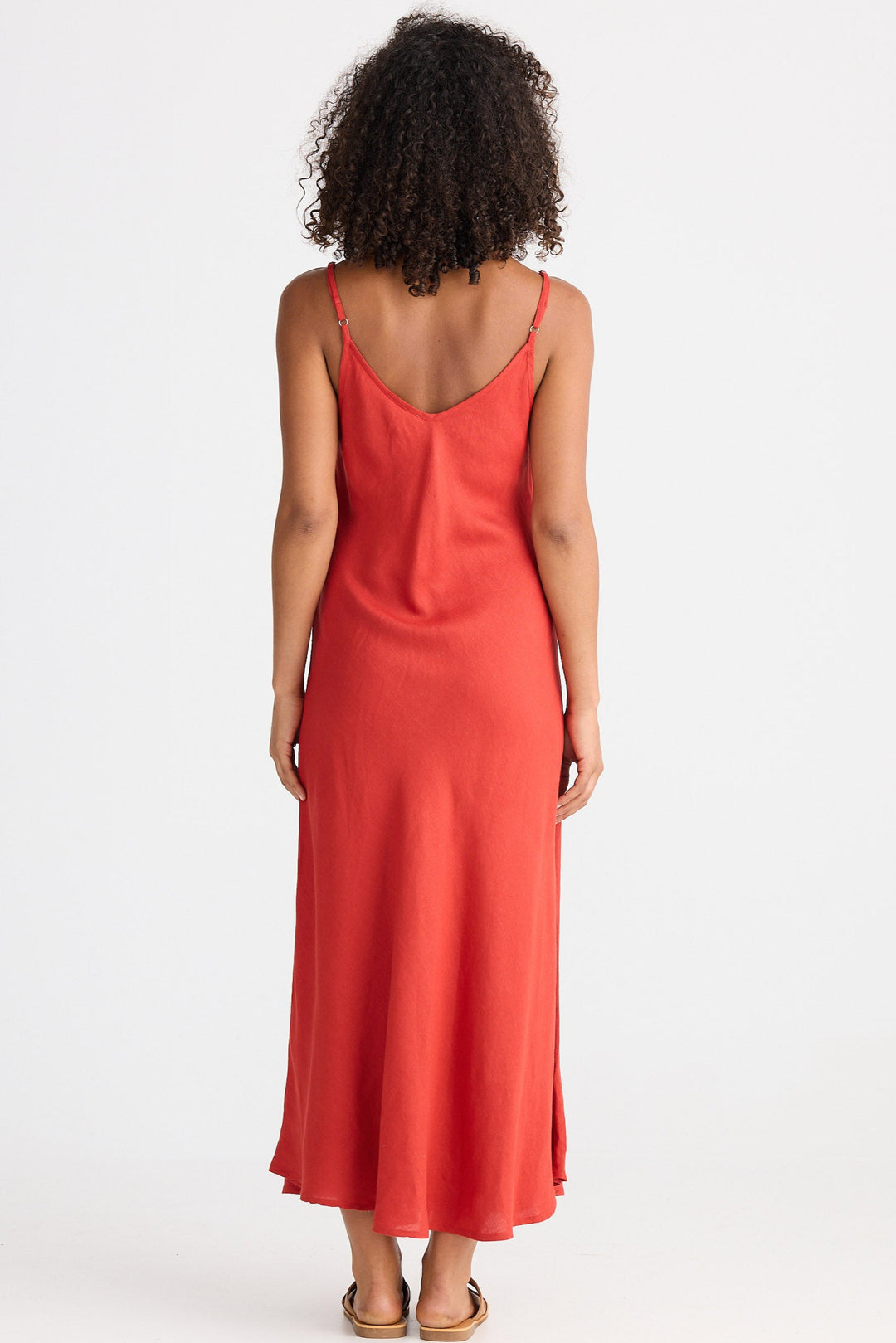 Woman wearing a red dress on a white background