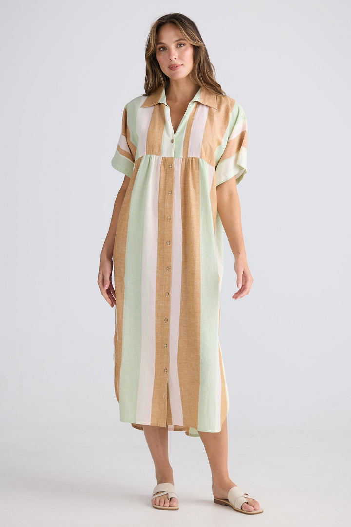 Woman wearing a striped dress on a white background