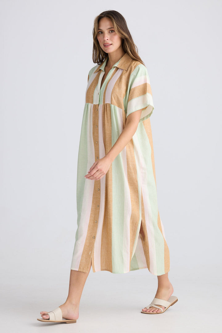 Woman wearing a striped dress on a white background