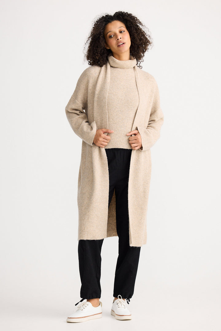 Model wearing oatmeal Lucerne Cardi, front view on white background